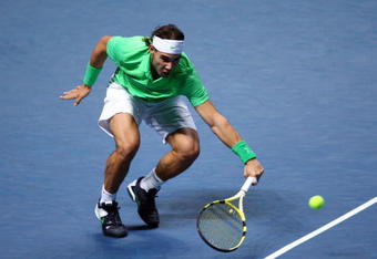 LONDON, ENGLAND - NOVEMBER 27:  Rafael Nadal of Spain returns the ball during the men's singles round robin match against Novak Djokovic of Serbia during the Barclays ATP World Tour Finals at the O2 Arena on November 27, 2009 in London, England.  (Photo by Clive Brunskill/Getty Images)