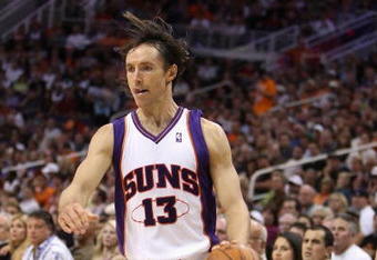 PHOENIX - NOVEMBER 11:  Steve Nash #13 of the Phoenix Suns handles the ball during the NBA game against the New Orleans Hornets at US Airways Center on November 11, 2009 in Phoenix, Arizona. The Suns defeated the Hornets 124-104.  NOTE TO USER: User expressly acknowledges and agrees that, by downloading and or using this photograph, User is consenting to the terms and conditions of the Getty Images License Agreement.  (Photo by Christian Petersen/Getty Images)