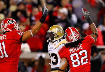 ATLANTA - NOVEMBER 28:  Aron White #81 and Michael Moore #82 of the Georgia Bulldogs celebrate Moore's touchdown against the Georgia Tech Yellow Jackets at Bobby Dodd Stadium on November 28, 2009 in Atlanta, Georgia.  (Photo by Kevin C. Cox/Getty Images)