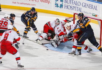 BUFFALO, NY - NOVEMBER 28: Michael Leighton #49  of the Carolina Hurricanes makes a pad save on a shot by Thomas Vanek #26 of the Buffalo Sabres  at HSBC Arena  on November 28, 2009 in Buffalo, New York.  (Photo by Rick Stewart/Getty Images)