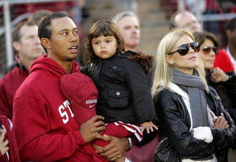 PALO ALTO, CA - NOVEMBER 21:  Honorary Standford Cardinal captain Tiger Woods his daugher, Sam, and wife, Elin Nordegren, stand on the sidelines before the Cardinal game against the California Bears at Stanford Stadium on November 21, 2009 in Palo Alto, California.  (Photo by Ezra Shaw/Getty Images)