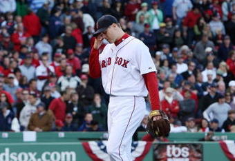 BOSTON - OCTOBER 11: Pitcher Jonathan Papelbon #58 of the Boston Red Sox reacts after being taken out of the game after blowing a save in the ninth inning against the Los Angeles Angels of Anaheim in Game Three of the ALDS during the 2009 MLB Playoffs at Fenway Park on October 11, 2009 in Boston, Massachusetts. The Angels defeated the Red Sox 7-6. (Photo by Jim Rogash/Getty Images)