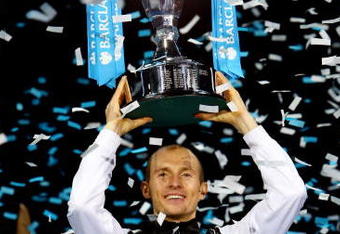LONDON, ENGLAND - NOVEMBER 29:  Nikolay Davydenko of Russia holds the trophy as he celebrates winning the men's singles final match against Juan Martin Del Potro of Argentina during the Barclays ATP World Tour Finals at the O2 Arena on November 29, 2009 in London, England.  (Photo by Julian Finney/Getty Images)