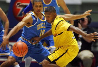 ANAHEIM, CA - NOVEMBER 29:  Stephan Gilling #33 of Long Beach State loses the ball on the dribble drive to the basket as Mustafa Abdul-Hamid #10 of UCLA defends in the first half during the 76 Classic at Anaheim Convention Center on November 29, 2009 in Anaheim, California.  (Photo by Victor Decolongon/Getty Images)