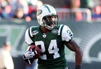 EAST RUTHERFORD, NJ - NOVEMBER 29:  Darrelle Revis #24 of the New York Jets runs the ball in for a first quarter touchdown after an interception against the Carolina Panthers on November 29, 2009 at Giants Stadium in East Rutherford, New Jersey.  (Photo by Jim McIsaac/Getty Images)