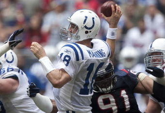 HOUSTON - NOVEMBER 29:  Quarterback Peyton Manning #18 of the Indianapolis Colts passes in traffic down-field in the third quarter against the Houston Texans at Reliant Stadium on November 29, 2009 in Houston, Texas.  (Photo by Bob Levey/Getty Images)