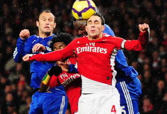 LONDON, ENGLAND - NOVEMBER 29: Cesc Fábregas of Arsenal defends a ball during the Barclays Premier League match between Arsenal and Chelsea at the Emirates Stadium on November 29, 2009 in London, England.  (Photo by Mike Hewitt/Getty Images)