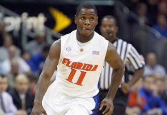KANSAS CITY, MO - NOVEMBER 24: Erving Walker #11 of the Florida Gators drives the ball downcourt against the Syracuse Orange during the CBE Classic game on November 24, 2008 at the Sprint Center in Kansas City, Missouri. (Photo by Jamie Squire/Getty Images)