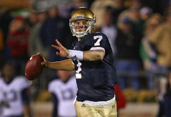SOUTH BEND, IN - NOVEMBER 21: Jimmy Clausen #7 of the Notre Dame Fighting Irish looks for a receiver in the first overtime period against the Univeristy of Connecticut Huskies at Notre Dame Stadium on November 21, 2009 in South Bend, Indiana. Connecticut defeated Notre Dame 33-30 in double overtime. (Photo by Jonathan Daniel/Getty Images)