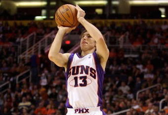 PHOENIX - NOVEMBER 22:  Steve Nash #13 of the Phoenix Suns puts up a three point shot during the NBA game against the Detroit Pistons at US Airways Center on November 22, 2009 in Phoenix, Arizona. The Suns defeated the Pistons 117-91. NOTE TO USER: User expressly acknowledges and agrees that, by downloading and or using this photograph, User is consenting to the terms and conditions of the Getty Images License Agreement.  (Photo by Christian Petersen/Getty Images)