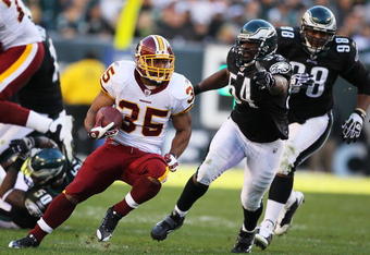 PHILADELPHIA - NOVEMBER 29:  Quinton Ganther #35 of the Washington Redskins runs with the ball as Jeremiah Trotter #54 of the Philadelphia Eagles chases during their game at Lincoln Financial Field on November 29, 2009 in Philadelphia, Pennsylvania.  (Photo by Al Bello/Getty Images)