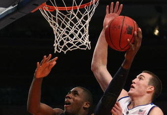 NEW YORK - NOVEMBER 27:  Alex Oriakhi #34 of the Connecticut Huskies shoots the ball against Miles Plumlee #21 of the Duke Blue Devils during the Championship game at Madison Square Garden on November 27, 2009 in New York, New York.  (Photo by Nick Laham/Getty Images)