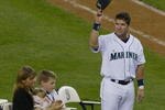 SEATTLE, WA - OCTOBER 2:  Edgar Martinez #11 of the Seattle Mariners (and his family) acknowledges the crowd during a post game ceremony honoring his 18 year career with the Mariners on October 2, 2004 at Safeco Field in Seattle, Washington.  (Photo by Lisa Blumenfeld/Getty Images)