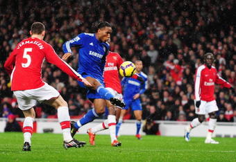 LONDON, ENGLAND - NOVEMBER 29:  Didier Drogba of Chelsea scores the opening goal during the Barclays Premier League match between Arsenal and Chelsea at the Emirates Stadium on November 29, 2009 in London, England.  (Photo by Mike Hewitt/Getty Images)
