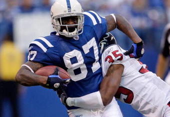 INDIANAPOLIS - NOVEMBER 8:  Reggie Wayne #87 of the Indianapolis Colts runs with the ball during the NFL game against the Houston Texans at Lucas Oil Stadium on November 8, 2009 in Indianapolis, Indiana.  The Colts defeated the Texans 20-17.  (Photo by Andy Lyons/Getty Images)