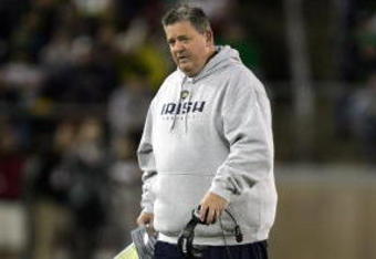 PALO ALTO, CA - NOVEMBER 28:  Notre Dame head coach Charlie Weis walks back to the sideline after speaking to his team during their game against the Stanford Cardinal at Stanford Stadium on November 28, 2009 in Palo Alto, California.  (Photo by Ezra Shaw/Getty Images)