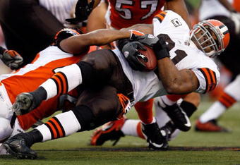 CINCINNATI - NOVEMBER 29:  Jamal Lewis #31 of the Cleveland Browns is tackled by Chris Crocker #42 of the Cincinnati Bengals during the NFL game at Paul Brown Stadium on November 29, 2009 in Cincinnati, Ohio.  (Photo by Andy Lyons/Getty Images)