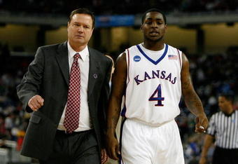 DETROIT - MARCH 28:  Head coach Bill Self and Sherron Collins #4 of the Kansas Jayhawks walk towards the bench against the Villanova Wildcats during the Midwest Regional Semifinal of the 2008 NCAA Division I Men's Basketball Tournament at Ford Field on March 28, 2008 in Detroit, Michigan  (Photo by Gregory Shamus/Getty Images)
