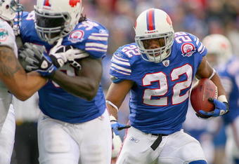 ORCHARD PARK, NY - NOVEMBER 29:  Fred Jackson #22 of the Buffalo Bills runs for his first  touchdown against  the Miami Dolphins behind a block by Corey McIntyre #38 at Ralph Wilson Stadium on November 29, 2009 in Orchard Park, New York. Buffalo won 31-14.  (Photo by Rick Stewart/Getty Images)