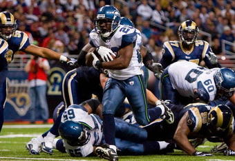 ST. LOUIS - NOVEMBER 29:  Justin Forsett #20 of the Seattle Seahawks scores a touchdown against the St. Louis Rams at the Edward Jones Dome on November 29, 2009 in St. Louis, Missouri.  The Seahawks beat the Rams 27-17.  (Photo by Dilip Vishwanat/Getty Images)