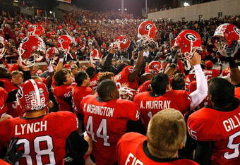 ATLANTA - NOVEMBER 28:  The Georgia Bulldogs celebrate their 30-24 win over the Georgia Tech Yellow Jackets at Bobby Dodd Stadium on November 28, 2009 in Atlanta, Georgia.  (Photo by Kevin C. Cox/Getty Images)