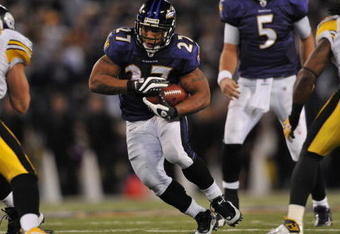 BALTIMORE - NOVEMBER 29:  Ray Rice #27 of the Baltimore Ravens runs the ball towards the center of the hashmarks in overtime to help set up the winning kick  against the Pittsburgh Steelers at M&T Bank Stadium on November 29, 2009 in Baltimore, Maryland. The Ravens defeated the Steelers 20-17. (Photo by Larry French/Getty Images)