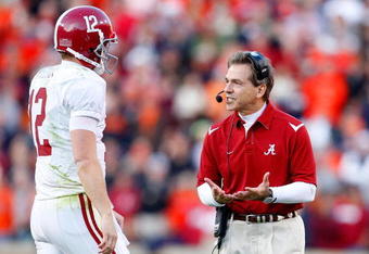 AUBURN, AL - NOVEMBER 27:  Head coach Nick Saban of the Alabama Crimson Tide converses with quarterback Greg McElroy #12 during the game against the Auburn Tigers at Jordan-Hare Stadium on November 27, 2009 in Auburn, Alabama.  (Photo by Kevin C. Cox/Getty Images)