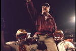 1 Jan 1996:  Head coach Bobby Bowden of the Florida State Seminoles is carried triumphantly off the field by nose guard Andre Wadsworth #8 and tackle Orpheus Roy after defeating the Notre Dame Fighting Irish in the Orange Bowl in Miami, Florida 31-26.  Ma