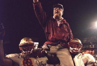 1 Jan 1996:  Head coach Bobby Bowden of the Florida State Seminoles is carried triumphantly off the field by nose guard Andre Wadsworth #8 and tackle Orpheus Roy after defeating the Notre Dame Fighting Irish in the Orange Bowl in Miami, Florida 31-26.  Ma