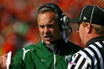 CHAMPAIGN, IL - OCTOBER 10: Head coach Mark Dantonio of the Michigan State Spartans argues with a referee during a game against the Illinois Fighting Illini on October 10, 2009 at Memorial Stadium at the University of Illinois in Champaign, Illinois. Michigan State defeated Illinois 24-14. (Photo by Jonathan Daniel/Getty Images)