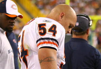GREEN BAY, WI - SEPTEMBER 13: Brian Urlacher #54 of the Chicago Bears stands on the sidelines after being injured near the end of the first half against the Green Bay Packers on September 13, 2009 at Lambeau Field in Green Bay, Wisconsin. The Packers defeated the Bears 21-15. (Photo by Jonathan Daniel/Getty Images)