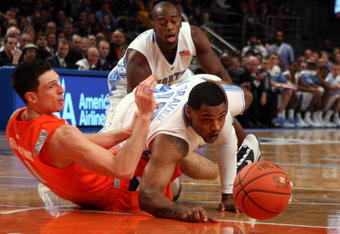 NEW YORK - NOVEMBER 20:  Will Graves #13 of the North Carolina Tar Heels battles for a loose ball against Andy Rautins #1 of the Syracuse Orange during the championship game of the 2K Sports Classic on November 20, 2009 at Madison Square Garden in New York City.  (Photo by Jim McIsaac/Getty Images)
