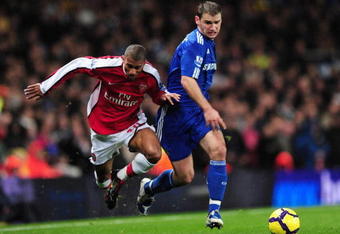 LONDON, ENGLAND - NOVEMBER 29:  Armand Traore of Arsenal challenges Branislav Ivanovic of Chelsea during the Barclays Premier League match between Arsenal and Chelsea at the Emirates Stadium on November 29, 2009 in London, England.  (Photo by Mike Hewitt/Getty Images)