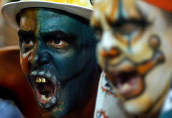 MIAMI - OCTOBER 12: Miami Dolphins fans scream at New York Jets fans prior to their game at Land Shark Stadium on October 12, 2009 in Miami, Florida.  (Photo by Marc Serota/Getty Images)