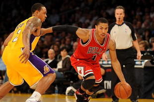 LOS ANGELES, CA - NOVEMBER 19:  Derrick Rose #1 of the Chicago Bulls drives against Shannon Brown #12 of the Los Angeles Lakers during the game on November 19, 2009 at Staples Center in Los Angeles, California.  The Lakers won 108-93.  NOTE TO USER: User expressly acknowledges and agrees that, by downloading and/or using this Photograph, User is consenting to the terms and conditions of the Getty Images License Agreement.   (Photo by Harry How/Getty Images)