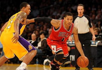 LOS ANGELES, CA - NOVEMBER 19:  Derrick Rose #1 of the Chicago Bulls drives against Shannon Brown #12 of the Los Angeles Lakers during the game on November 19, 2009 at Staples Center in Los Angeles, California.  The Lakers won 108-93.  NOTE TO USER: User expressly acknowledges and agrees that, by downloading and/or using this Photograph, User is consenting to the terms and conditions of the Getty Images License Agreement.   (Photo by Harry How/Getty Images)