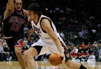 MILWAUKEE - NOVEMBER 30: Andrew Bogut #6 of the Milwuakee Bucks drives around Joakim Noah #13 of the Chicago Bulls at the Bradley Center on November 30, 2009 in Milwaukee, Wisconsin. The Bucks defeated the Bulls 99-97. NOTE TO USER: User expressly acknowledges and agrees that, by downloading and/or using this Photograph, User is consenting to the terms and conditions of the Getty Images License Agreement. (Photo by Jonathan Daniel/Getty Images)