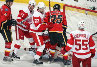 CALGARY, CANADA - OCTOBER 31: Brad Stuart #23 of the Detroit Red Wings defends the low slot area against the Calgary Flames during their game on October 31, 2009 at the Pengrowth Saddledome in Calgary, Alberta, Canada. The Red Wings defeated the Flames 3-1. (Photo by Dale MacMillan/Getty Images)