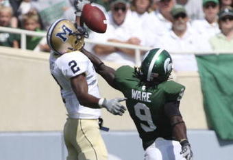 EAST LANSING, MI - SEPTEMBER 05: Defensive back Jeremy Ware #9 of the Michigan State Spartans defends the pass against wide receiver Elvis Akpla #2 of Montana State during the game on September 5, 2009 at Spartan Stadium in East Lansing, Michigan.  (Photo by Leon Halip/Getty Images)
