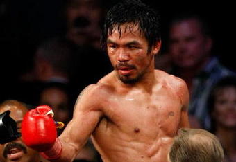 LAS VEGAS - NOVEMBER 14:  Manny Pacquiao celebrates his 12 round TKO victory against Miguel Cotto during their WBO welterweight title fight at the MGM Grand Garden Arena on November 14, 2009 in Las Vegas, Nevada.  (Photo by Ethan Miller/Getty Images)