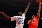 NEW YORK - NOVEMBER 20:  Arinze Onuaku #21 of the Syracuse Orange shoots against Ed Davis #32 of the North Carolina Tar Heels during the championship game of the 2K Sports Classic on November 20, 2009 at Madison Square Garden in New York City. The Orange defeated the Tar Heels 87-71 to win the championship.  (Photo by Jim McIsaac/Getty Images)