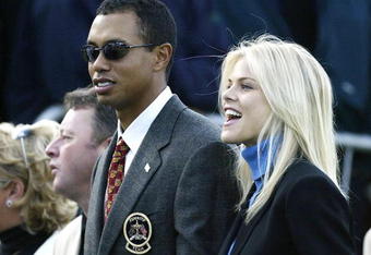 SUTTON COLDFIELD - SEPTEMBER 26:  Golfer Tiger Woods poses with girlfriend Elin Nordegren during the opening Ceremony for the 34th Ryder Cup on September 26, 2002 in Sutton Coldfield, England. (Photo by Andrew Redington/Getty Images)
