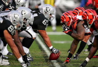 OAKLAND, CA - NOVEMBER 22:  Samson Satele #64 of the Oakland Raiders prepares to snap the ball during their game against the Cincinnati Bengals at Oakland-Alameda County Coliseum on November 22, 2009 in Oakland, California.  (Photo by Ezra Shaw/Getty Images)
