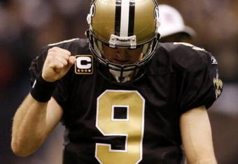 NEW ORLEANS - NOVEMBER 30: Quarterback Drew Brees #9 of the New Orleans Saints celebrates after a touchdown against the New England Patriots at Louisana Superdome on November 30, 2009 in New Orleans, Louisiana.  (Photo by Chris Graythen/Getty Images)