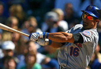 CHICAGO - AUGUST 30: Angel Pagan #16 of the New York Mets swings the bat against the Chicago Cubs on August 30, 2009 at Wrigley Field in Chicago, Illinois. The Mets defeated the Cubs 4-1. (Photo by Jonathan Daniel/Getty Images)
