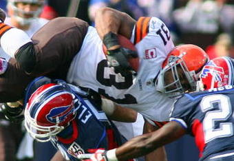 ORCHARD PARK, NY - OCTOBER 11:  Jamal Lewis #31 of the Cleveland Browns tries to jump over Keith Ellison #56 of the Buffalo Bills during their NFL game at Ralph Wilson Stadium on October 11, 2009 in Orchard Park, New York. The Browns defeated the Bills 6-3. (Photo by Rick Stewart/Getty Images)