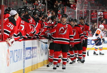 NEWARK, NJ - NOVEMBER 28:  Jamie Langenbrunner #15 of the New Jersey Devils celebrates a goal against the New York Islanders at the Prudential Center on November 28, 2009 in Newark, New Jersey.  (Photo by Jim McIsaac/Getty Images)