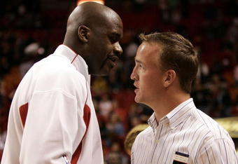 MIAMI - FEBRUARY 14:  Peyton Manning of the Indianapolis Colts talks with Shaquille O'Neal #32 of the Miami Heat prior to the start of the Heat's game against the Orlando Magic February 14, 2006 at the American Airlines Arena in Miami  Florida. NOTE TO USER: User expressly acknowledges and agrees that, by downloading and/or using this Photograph, User is consenting to the terms and conditions of the Getty Images License Agreement.  (Photo by Eliot J. Schechter/Getty Images) 