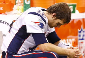 NEW ORLEANS - NOVEMBER 30: Quarterback Tom Brady #12 of the New England Patriots sits dejected on the bench late in the fourth quarter against the New Orleans Saints at Louisana Superdome on November 30, 2009 in New Orleans, Louisiana. (Photo by Scott Halleran/Getty Images)