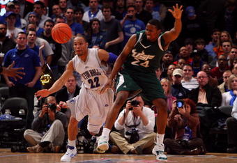 NEW YORK - MARCH 10:  Paul Gause #22 of the Seton Hall Pirates fights for a loose ball against Augustus Gilchrist #24 of the USF Bulls during the first round of the Big East Tournament at Madison Square Garden on March 10, 2009 in New York City.  (Photo by Jim McIsaac/Getty Images)